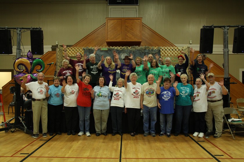 Lagniappe Members with T-shirts waving - IMG_0441